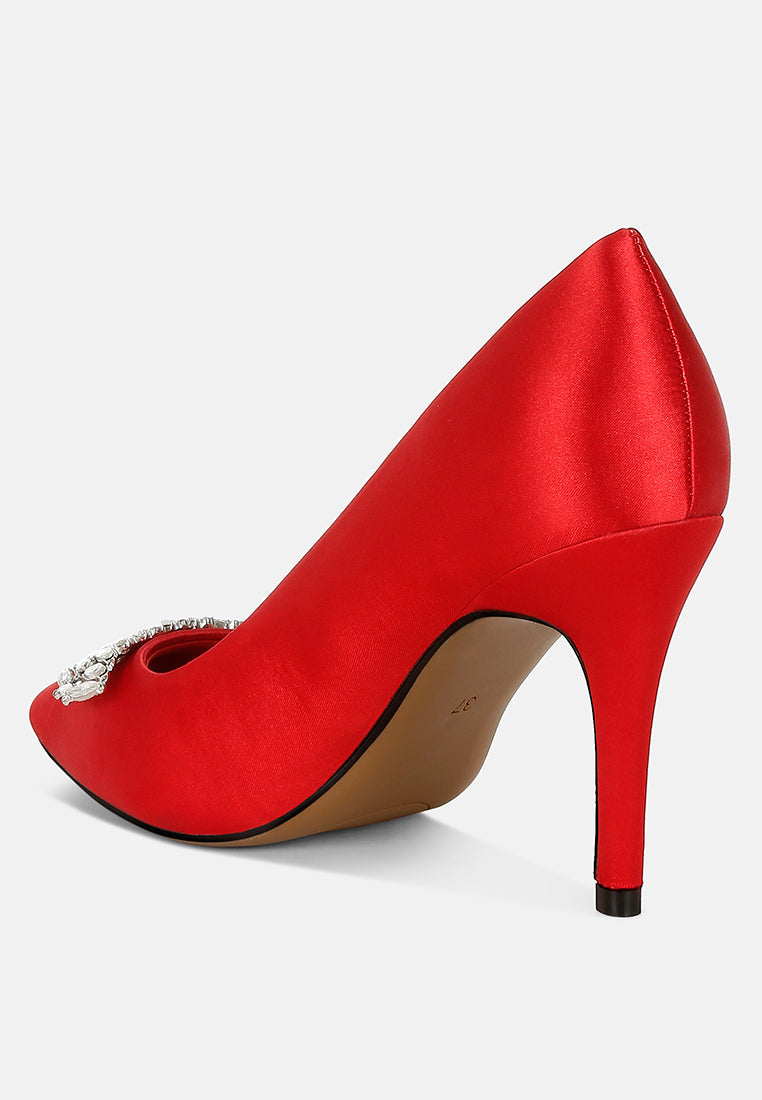 Red Diamante Brooch Detail Satin Pumps by London Rag – satin pointed-toe pumps with a diamante brooch detail, stiletto heel, and cushioned insole, angled view