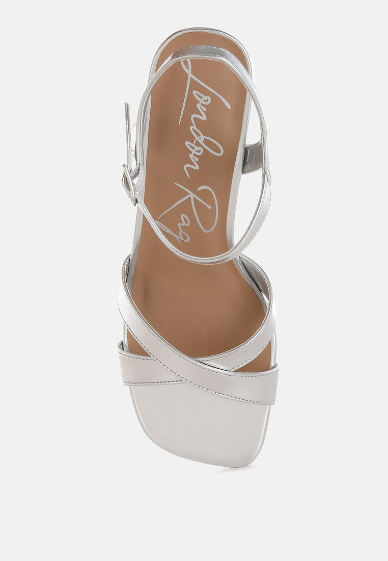 Silver Square Toe Block Heel Sandals by London Rag – square-toe block heel sandals in faux leather with an ankle strap and cushioned insole, sole and heel view