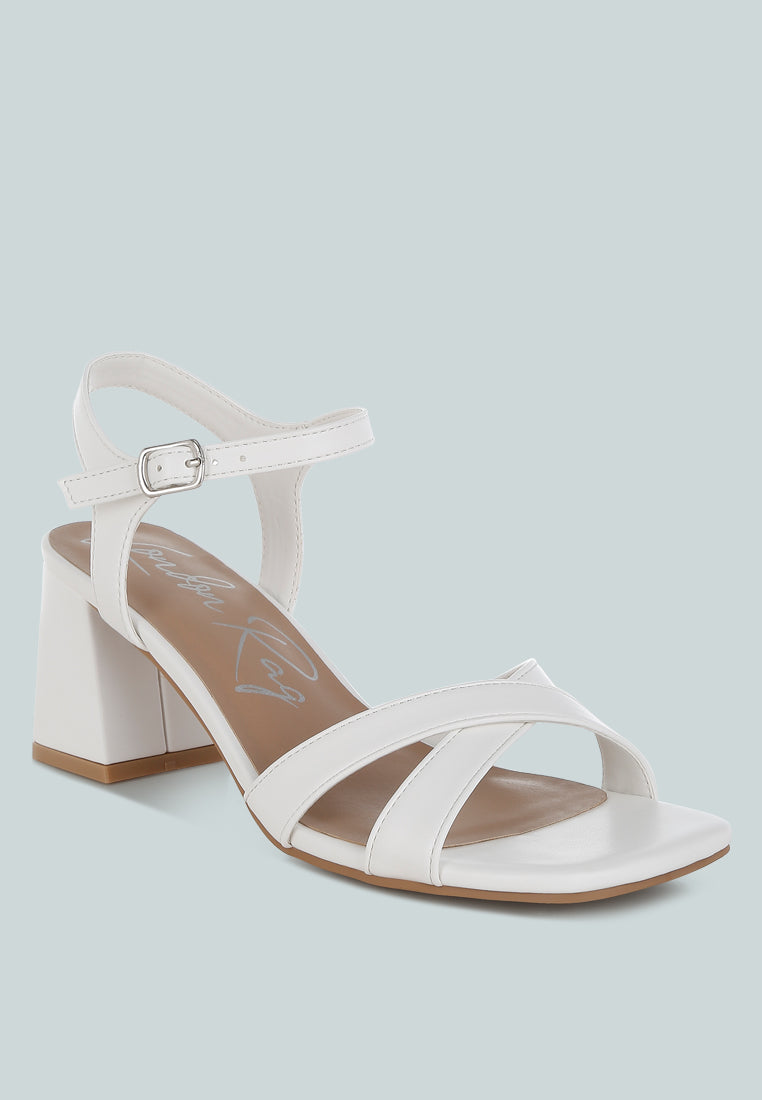 White Square Toe Block Heel Sandals by London Rag – square-toe block heel sandals in faux leather with an ankle strap and cushioned insole, side profile view