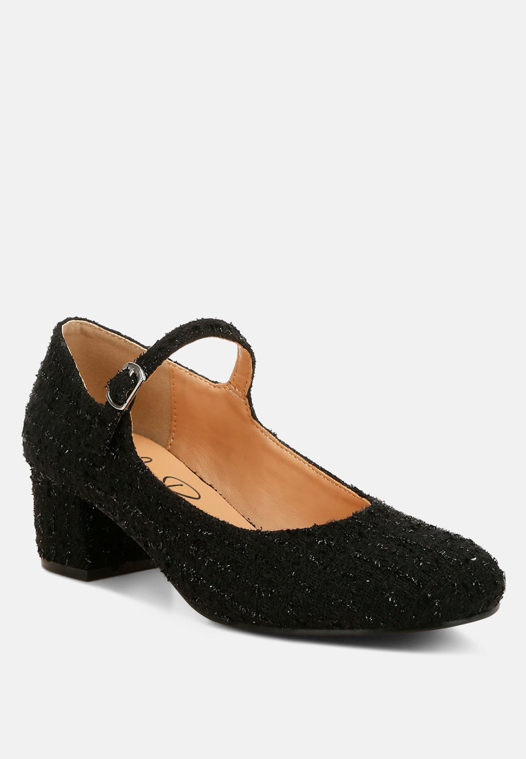 Black Tweed Mary Jane Sandals by London Rag – Mary Jane sandals with a tweed fabric upper, ankle strap, and low block heel, side profile view