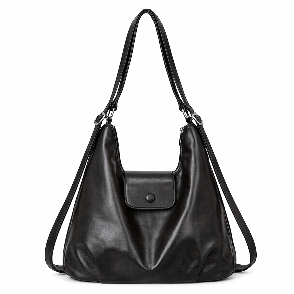 Black Deluxxie Relaxed Faux-Leather Shoulder Bag with slouchy crescent shape, front button-flap pocket and silver-tone strap hardware, shown on a white background