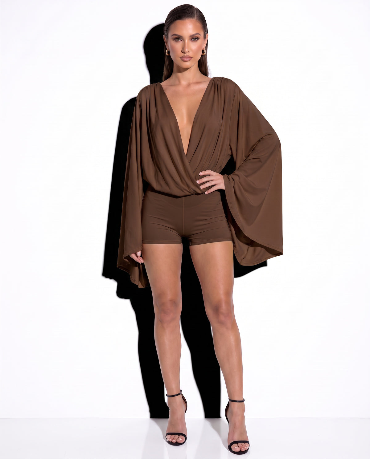 Emily Grace in the Afterhours Plunge Open-Back Romper in Mocha
